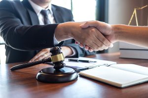 Handshake between a divorce attorney and his client.