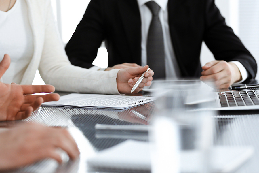 Closeup of a client meeting with an attorney.