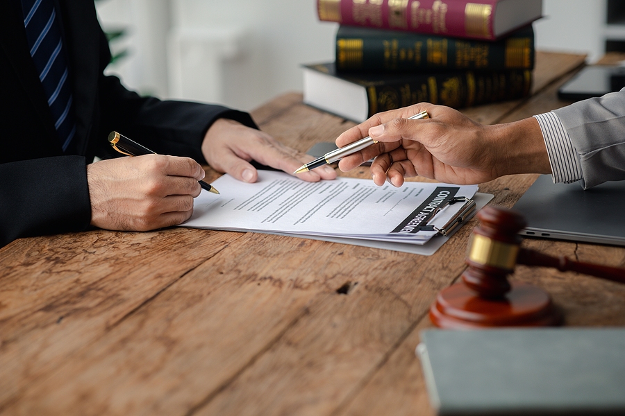 Closeup of a client meeting with his attorney.